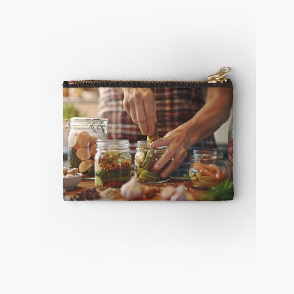 Item preview, Person preparing jars of homemade pickled vegetables in cozy kitchen, AI generated designed and sold by dvoevnore.