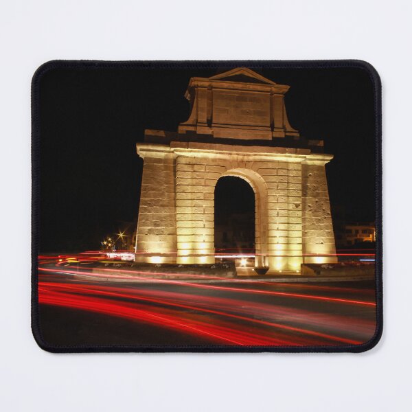 Item preview, Illuminated Stone Arch Monument At Night Surrounding Roundabout With Red Light Trails designed and sold by Nmallia.