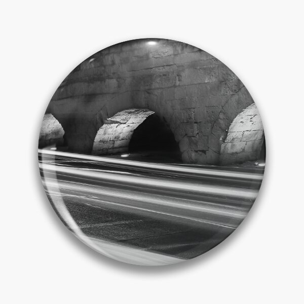Item preview, Nighttime Stone Bridge With Arches And Light Trails Over A Quiet Urban Road designed and sold by Nmallia.