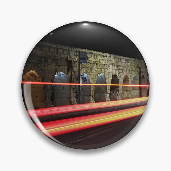 Item preview, Night Street With Historic Stone Archway And Red Light Trails On Busy Urban Road designed and sold by Nmallia.