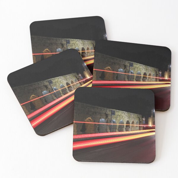 Item preview, Night Street With Historic Stone Archway And Red Light Trails On Busy Urban Road designed and sold by Nmallia.