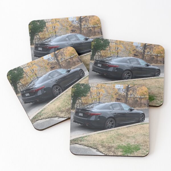 Item preview, Sleek Black Alfa Romeo Giulia Sedan Amid Autumn Streetscape designed and sold by letsnvision.