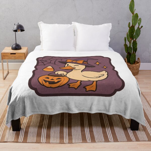 Item preview, Cute Witch Duck with Pumpkin Bucket – Adorable Halloween Cartoon Design designed and sold by RuweisVibes.