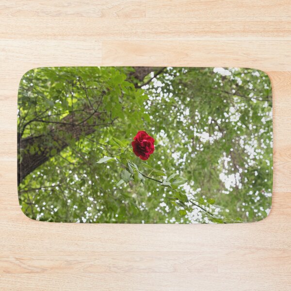 Item preview, Solitary Red Rose Against Green Treetop Leaves designed and sold by Georgia Mizuleva.