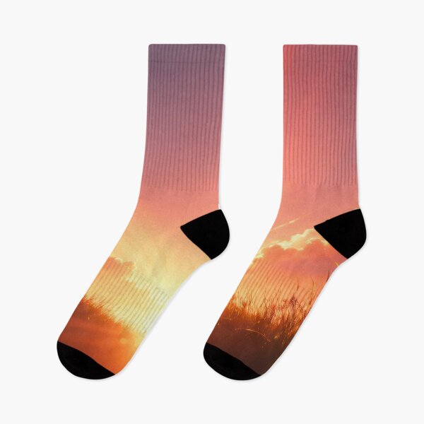 Item preview, Golden sunrise over grassy field with glowing clouds and warm sunlight spreading across peaceful horizon designed and sold by Mimoshi ⭐⭐⭐⭐⭐.