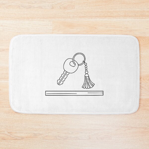 Item preview, A tassel dangling from a keychain in key on a wooden desk designed and sold by rasagamastore.