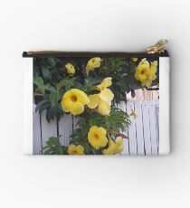 yellow flowers on the gatedoor Studio Pouch