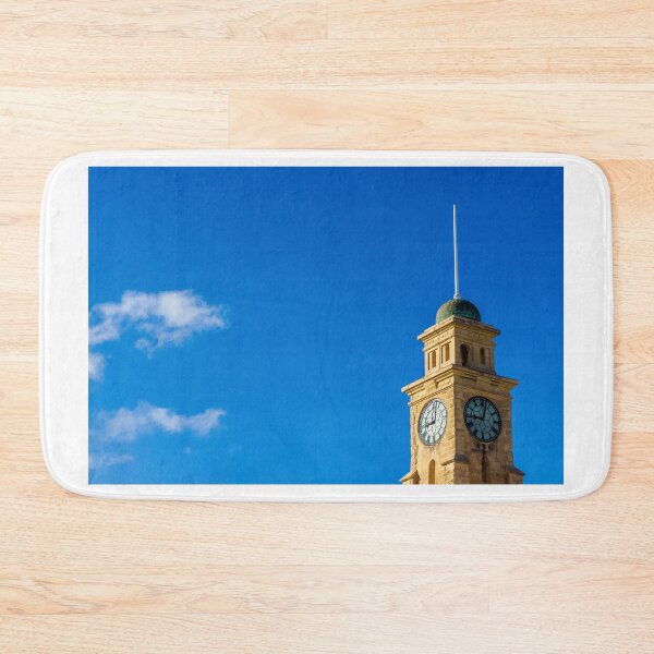 Item preview, Historic Clock Tower Against a Clear Blue Sky with Sparse Clouds designed and sold by Nmallia.