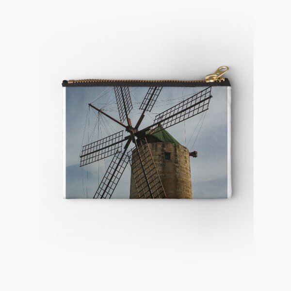 Item preview, Old Stone Windmill With Large Wooden Blades Against Clear Sky, Historic Rural Landmark designed and sold by Nmallia.