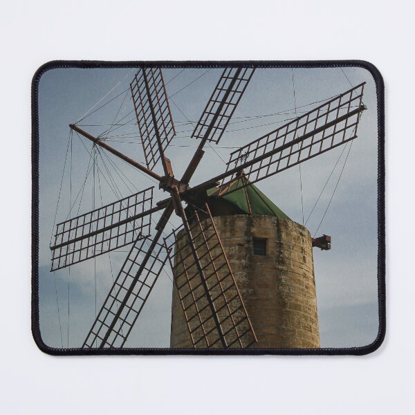 Item preview, Old Stone Windmill With Large Wooden Blades Against Clear Sky, Historic Rural Landmark designed and sold by Nmallia.