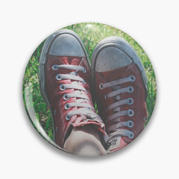 Item preview, Worn Red Sneakers Lying in Green Grass - Summer Chill Aesthetic designed and sold by MDB_Shop.