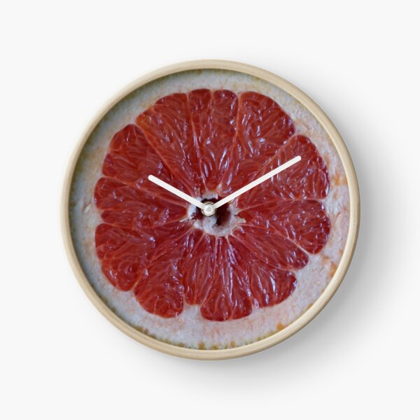 Cut grapefruit. Clock