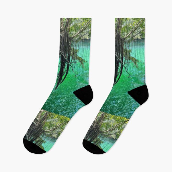 Item preview, Hanging Tree Roots Over Shimmering Emerald Green Water designed and sold by TrisaThyme.