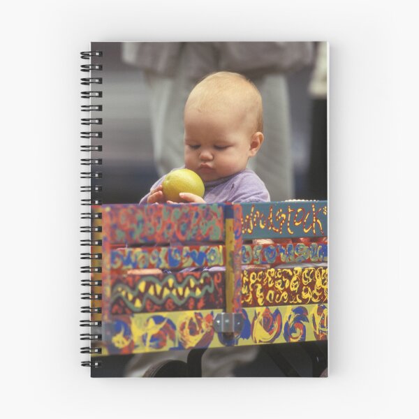 Item preview, A Toddler Checking His fruit At Woodstock 94 - Photograph designed and sold by ConcertImages.