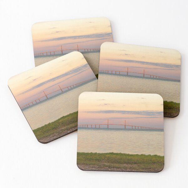 Item preview, The Sunshine Skyway Bridge stretches gracefully across Tampa Bay at dawn, bathed in soft golden light as the new day begins designed and sold by EyezWatchin.