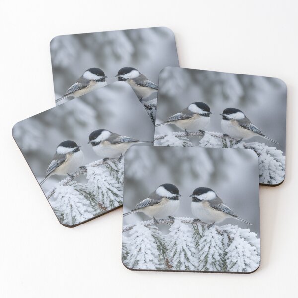 Item preview, Two black capped chickadees perched on a snow-covered pine branch designed and sold by homydesign.