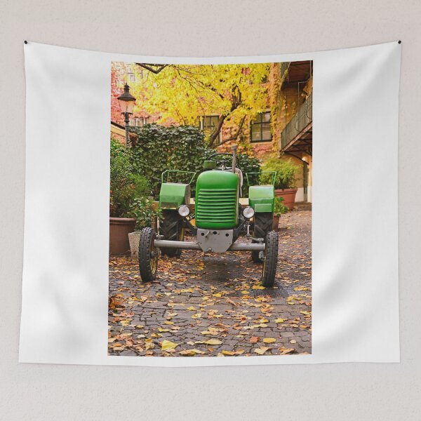Item preview, Old green tractor in courtyard during Autumn season, Vienna designed and sold by goceris.