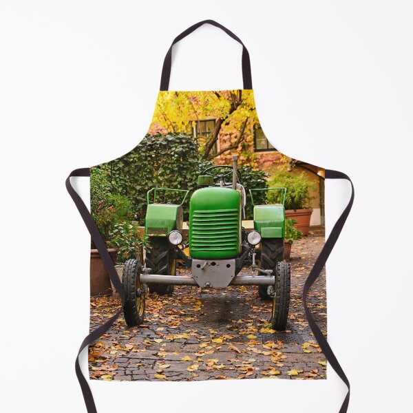 Item preview, Old green tractor in courtyard during Autumn season, Vienna designed and sold by goceris.