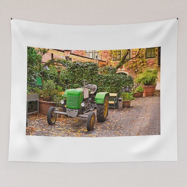 Item preview, Old green tractor in courtyard during Autumn season, Vienna, Austria  designed and sold by goceris.