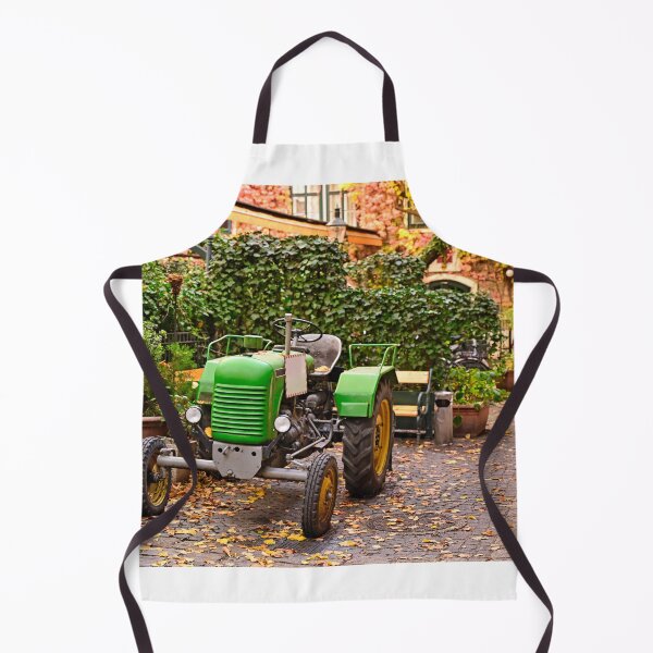 Item preview, Old green tractor in courtyard during Autumn season, Vienna, Austria  designed and sold by goceris.