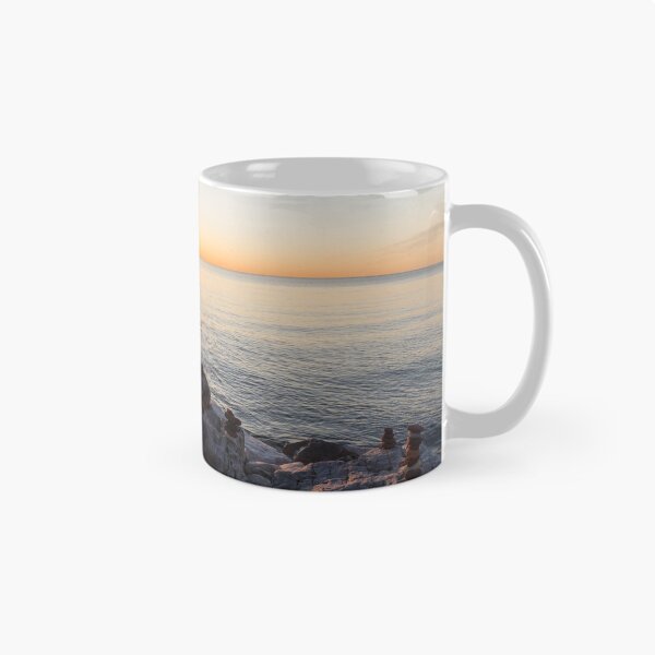 Item preview, Lake Shore Sunrise Over Rough Rocks and Stone Stacks designed and sold by Georgia Mizuleva.
