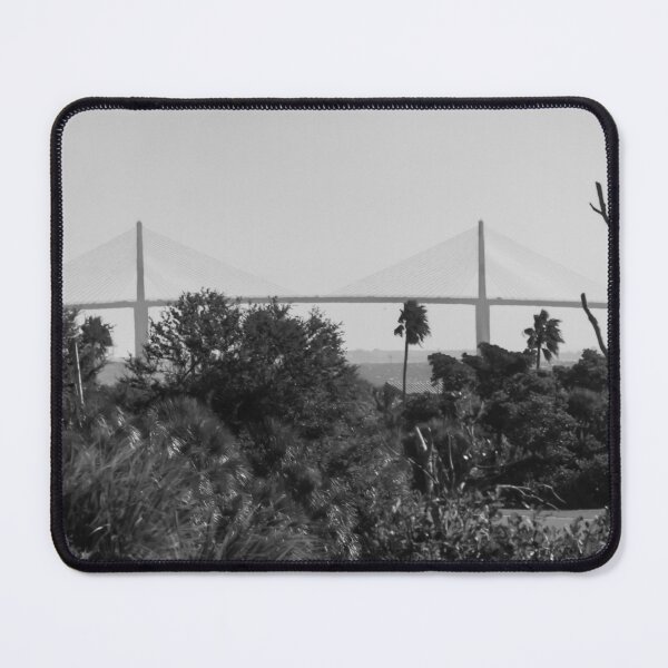 Item preview, The Sunshine Skyway Bridge stretches gracefully across Tampa Bay at dawn, bathed in soft golden light as the new day begins designed and sold by EyezWatchin.