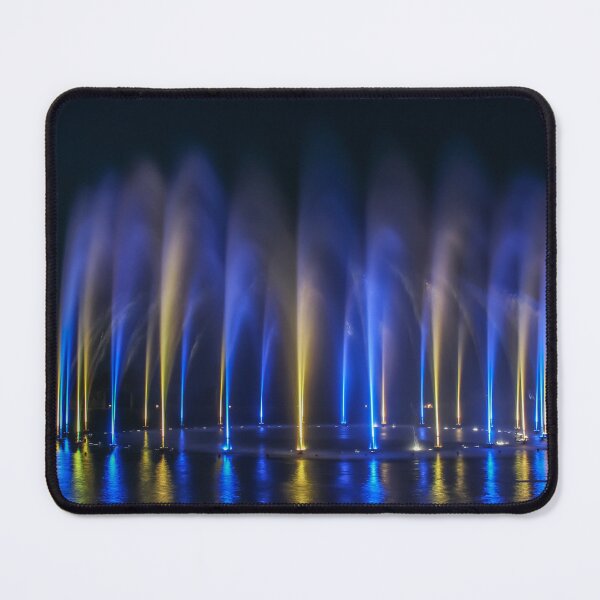 Item preview, Nighttime Fountain Show With Blue And Yellow Lights Reflections On Water designed and sold by Nmallia.