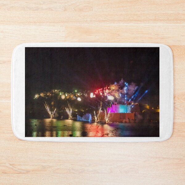 Item preview, Colorful Waterfront Fireworks Show Over Night Scene With Reflections And Illuminated Buildings designed and sold by Nmallia.