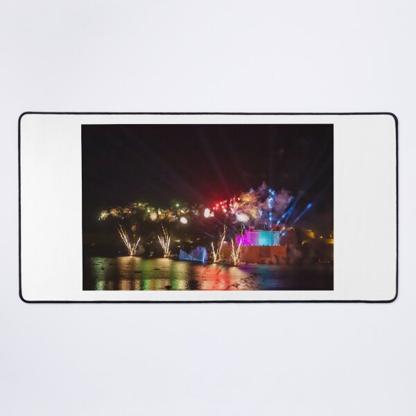 Item preview, Colorful Waterfront Fireworks Show Over Night Scene With Reflections And Illuminated Buildings designed and sold by Nmallia.