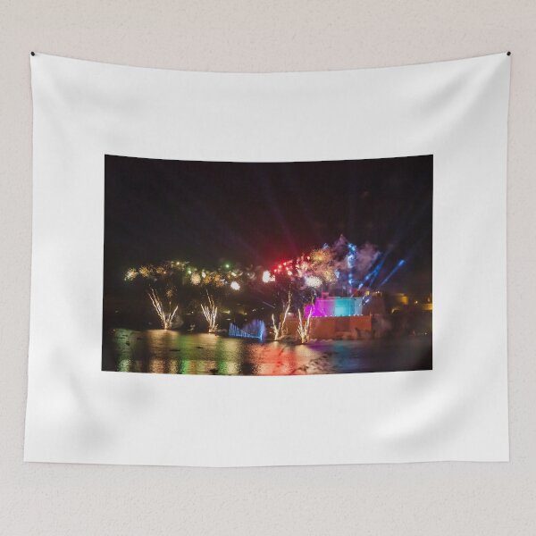 Item preview, Colorful Waterfront Fireworks Show Over Night Scene With Reflections And Illuminated Buildings designed and sold by Nmallia.