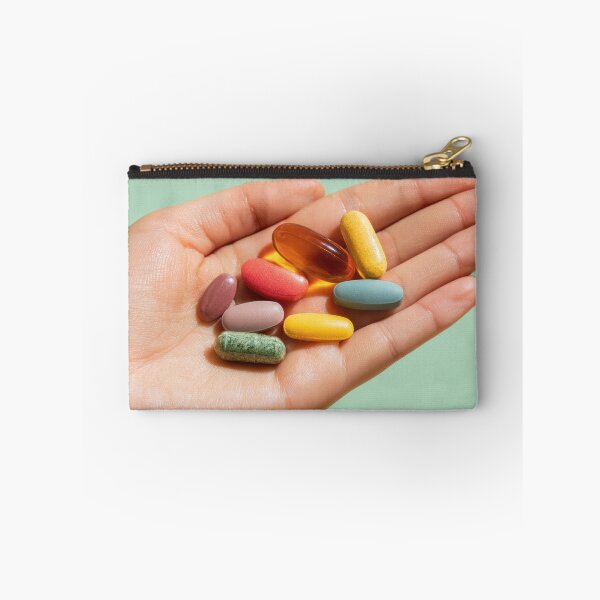 Item preview, Colorful vitamins held in a hand designed and sold by anytka.
