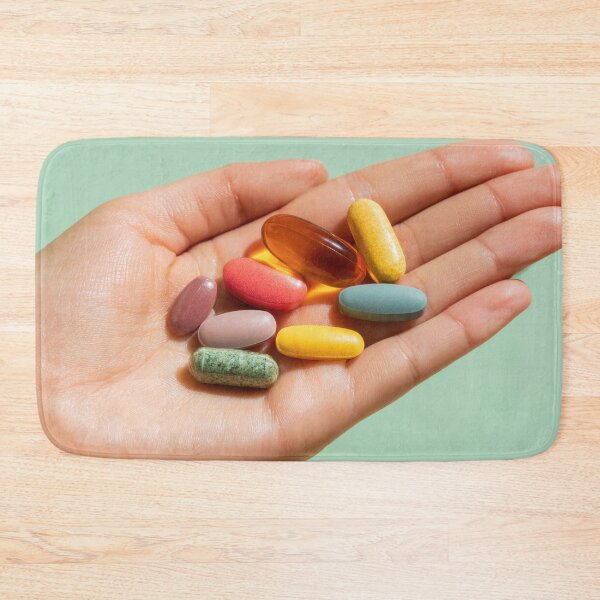 Item preview, Colorful vitamins held in a hand designed and sold by anytka.