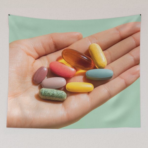 Item preview, Colorful vitamins held in a hand designed and sold by anytka.