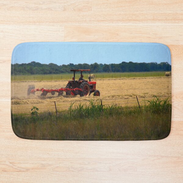 Item preview, Texas rancher on red tractor harvests hay  designed and sold by Visual-Minds.