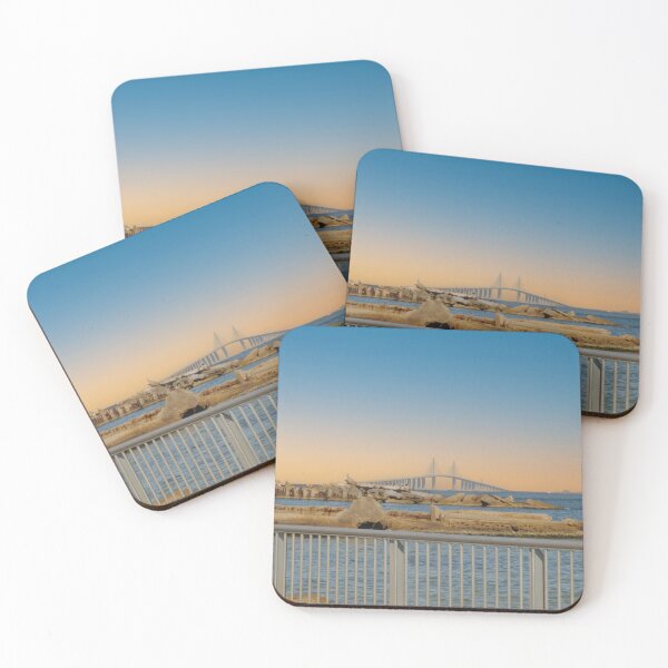 Item preview, The Sunshine Skyway Bridge stretches gracefully across Tampa Bay at dawn, bathed in soft golden light as the new day begins designed and sold by EyezWatchin.