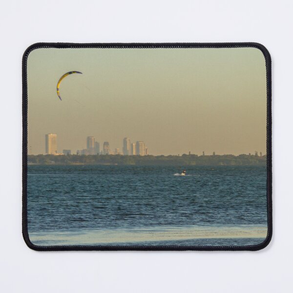 Item preview, The orange sunrise fills the orange sky above casting warm golden light across Tampa Bay while lone kite surfer glides designed and sold by EyezWatchin.