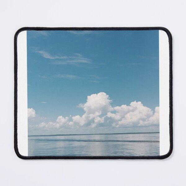 Item preview, White Clouds In Blue Sky Over Calm Waters Photographic Print designed and sold by Mother-Nature65.