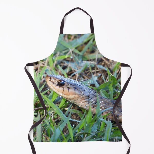 Item preview, Keelback snake close up in wet grass designed and sold by Mark Grimsley.