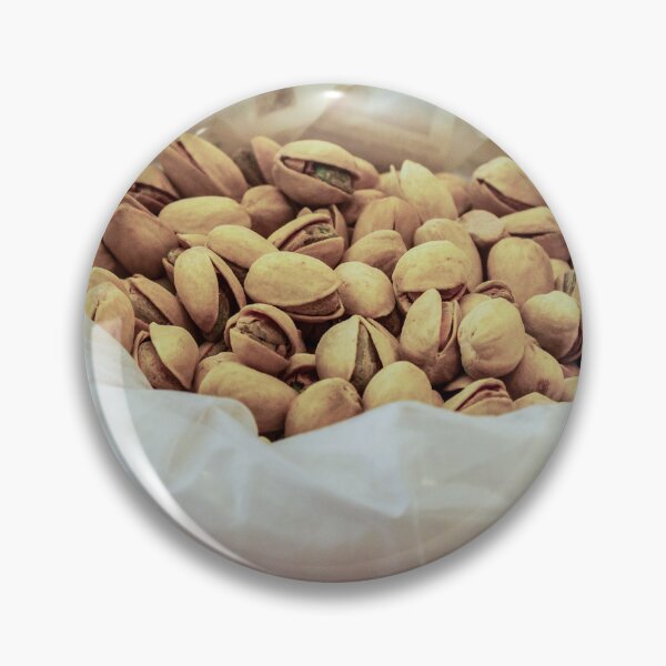Item preview, Heap of Pistachios in a Clear Plastic Bag Displayed on Market Counter designed and sold by Nmallia.