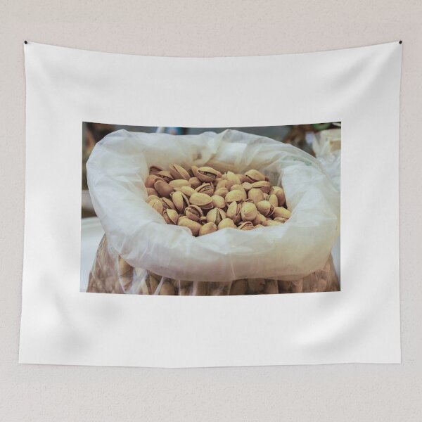 Item preview, Heap of Pistachios in a Clear Plastic Bag Displayed on Market Counter designed and sold by Nmallia.