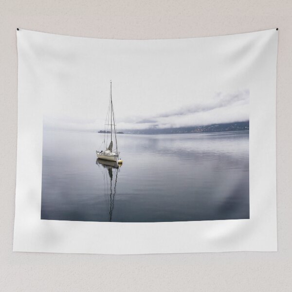 Item preview, Sailing Boat with Reflection on Lake Maggiore with Brissago Islands in a Foggy Day designed and sold by Mats Silvan.
