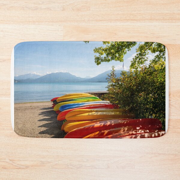 Item preview, View of Lake Annecy with Mountain and Colorful Canoe on the Beach in a Sunny Summer Day designed and sold by Mats Silvan.