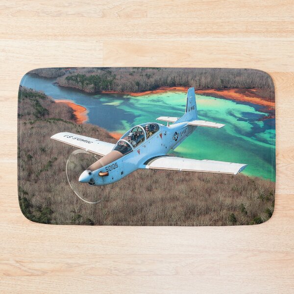 Item preview, Military Tucano Climbing Over the Airfield Region under Clear Skies designed and sold by Skyframe Aviation.
