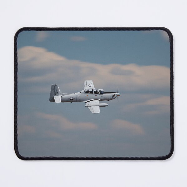 Item preview, Light Attack Super Tucano Maneuvering Through the Hills of Brazil at Dusk designed and sold by Skyframe Aviation.