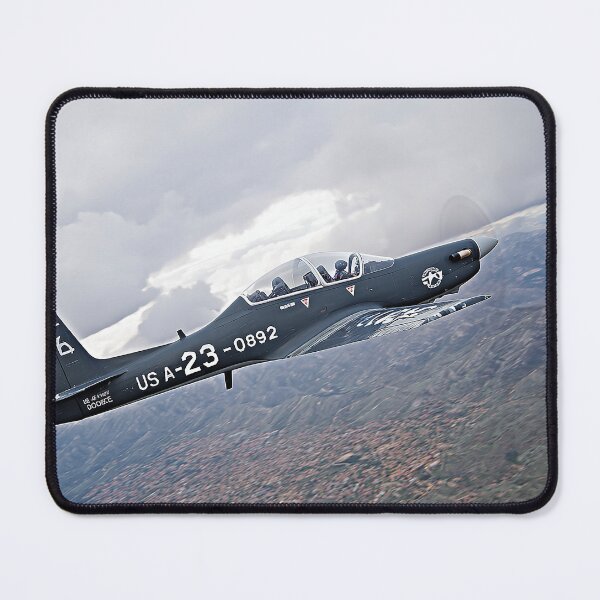 Item preview, Military Tucano Maneuvering Through the Jungle Below at Dusk designed and sold by Skyframe Aviation.