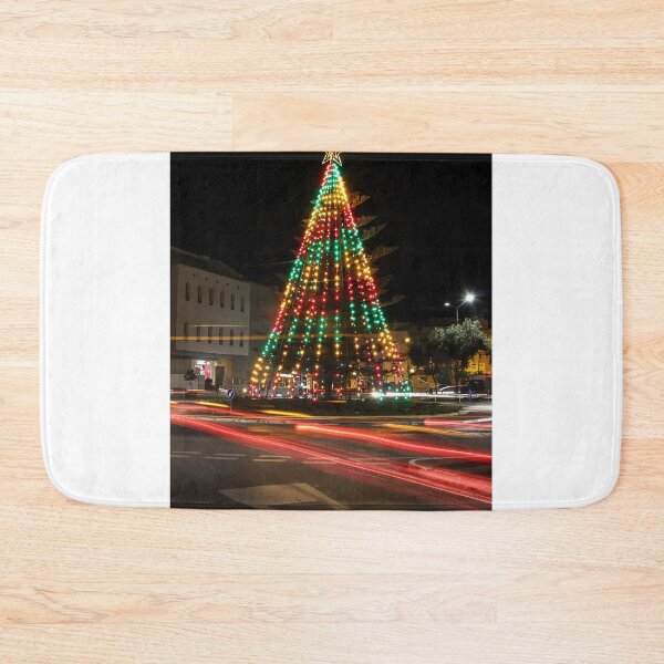 Item preview, Colorful Christmas Tree Illuminated at Night in Roundabout With Moving Car Light Trails designed and sold by Nmallia.