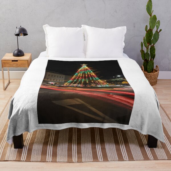 Item preview, Colorful Christmas Tree Illuminated at Night in Roundabout With Moving Car Light Trails designed and sold by Nmallia.