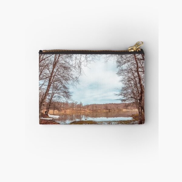 Item preview, Bare Deciduous Trees Frame a Forest Lake on a Cold Day with Melting Snow and Muddy Shores. designed and sold by MDB_Shop.