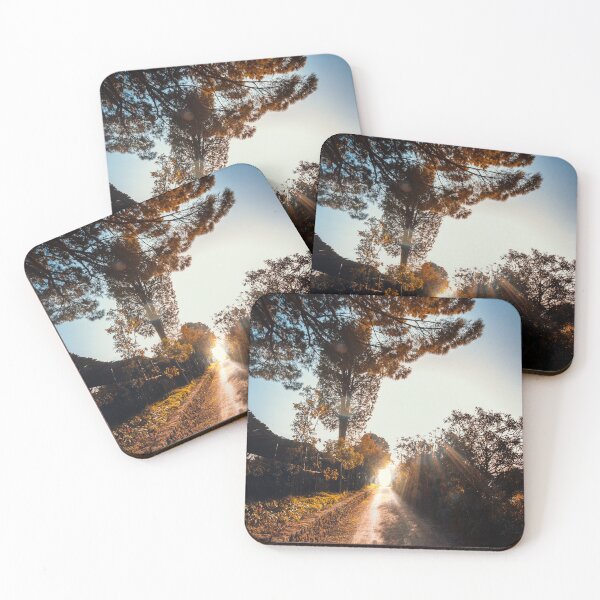 Item preview, Cinematic dirt road leading toward brilliant sunset light with dramatic sun rays and foliage frame. designed and sold by MDB_Shop.