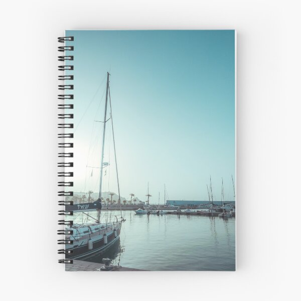 Item preview, Sailing yachts docked in a calm harbor under a bright, turquoise sky. designed and sold by MDB_Shop.